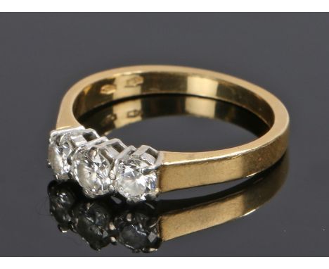 18 carat gold diamond set ring, with three brilliant cut diamonds to the head totalling 0.63 carat, ring size O