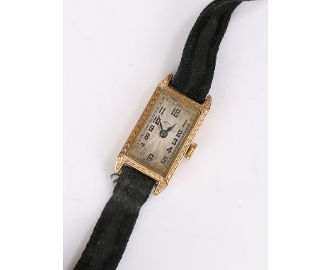 Ladies 9 carat gold wristwatch, the engine turned dial with Arabic numerals, manual wound, the case 14mm wide