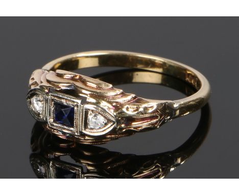 18 carat gold diamond and sapphire set ring, with a central sapphire flanked by a diamond to either shoulder, ring size R