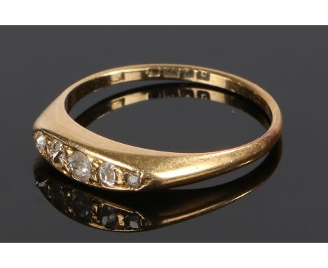 18 carat gold diamond set ring, with five round cut diamonds to the head, ring size M 1/2