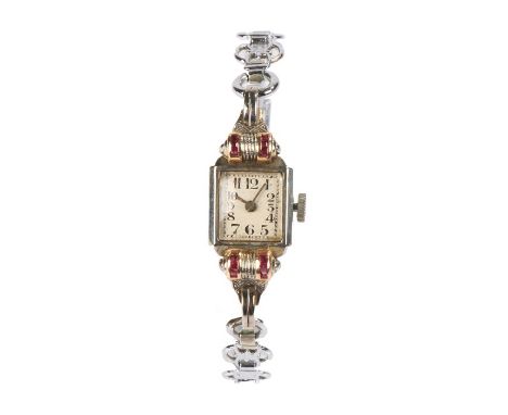 18 carat white gold and ruby set ladies cocktail watch, the white dial with Arabic numerals, manual wound, the case 13mm wide