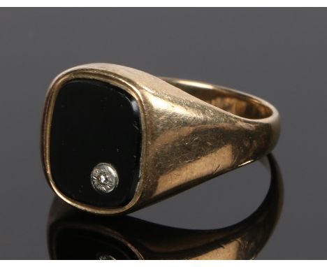 9 carat gold signet ring, with an onyx head set with a diamond, ring size, ring size S