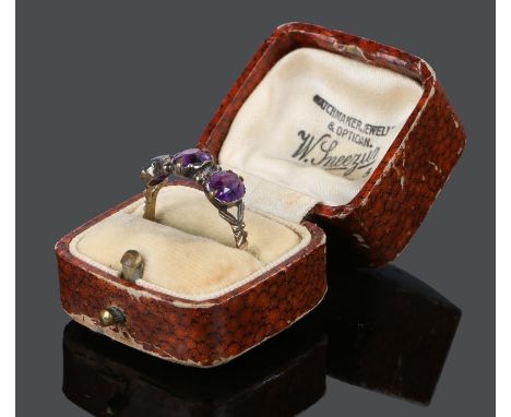 19th Century amethyst set ring, with three facetted amethysts to the head, ring size S 