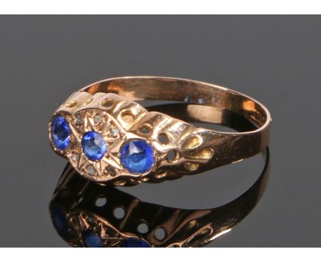 9 carat gold sapphire and diamond set ring, with three sapphires and six diamond chips, ring size P