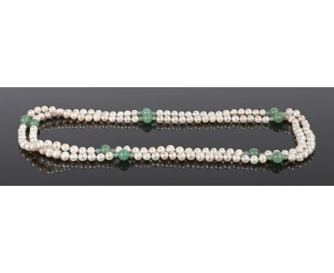 Pearl and jade necklace, with a long strand of pearls and interspersed jade beads, 135cm long