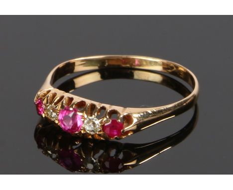 18 carat gold ruby and diamond set ring, the pierced head set with three rubies and two diamonds, ring size T