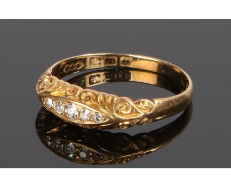 18 carat gold diamond set ring, with five round cut diamonds to the head, rings size Q