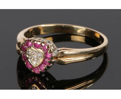 9 carat gold ruby and diamond ring, the heart form head set with rubies and with diamonds to the centre ring size M 1/2