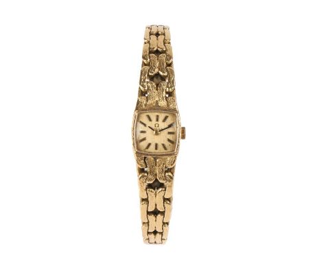 Omega 18 carat gold ladies wristwatch, the signed engine turned dial with baton markers, crown wound, on an 18 carat gold bra