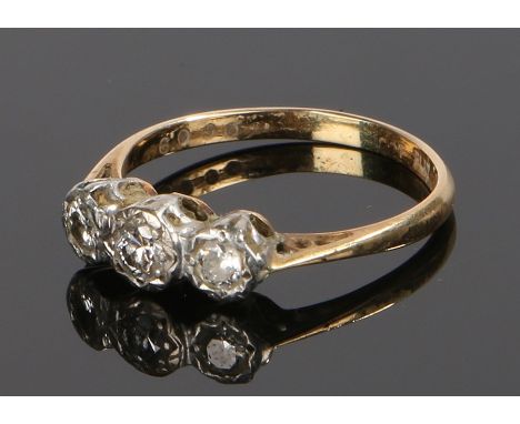 18 carat gold diamond ring, the head set with three round cut diamonds, ring size N