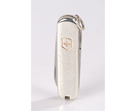 Tiffany &amp; Co Victorinox silver mounted Swiss Army knife, with Swiss cross to the foliate engraved handle, 6cm long