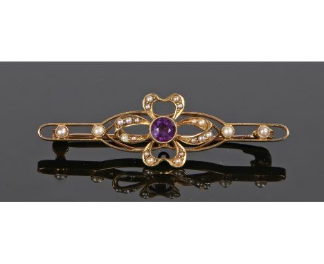 15 carat gold amethyst and pearl brooch, the head in the form of a ribbon flower head with pearls to the bar, 3.3 grams, 50mm