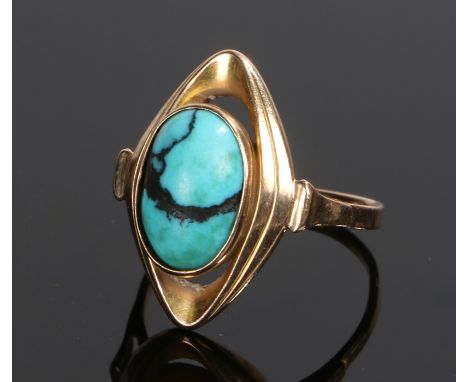 9 carat gold and turquoise set ring, the cabochon cut turquoise with an arched loop surround, ring size M