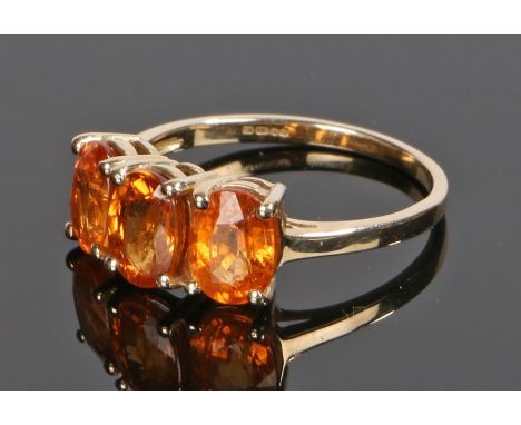 9 carat gold ring, set with three orange gemstones to the head, ring size O