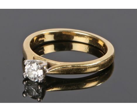 18 carat gold diamond solitaire ring, the round cut diamond at approximately 0.34 carat, ring size N