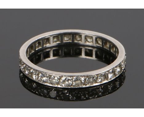 Platinum and diamond set eternity ring, with a row of twenty six round cut diamonds at 0.04 carat each making a total of 1.04