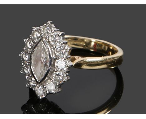 18 carat gold diamond cluster ring, the marquise cut central diamond at approximately 0.55 carat and a diamond surround, ring