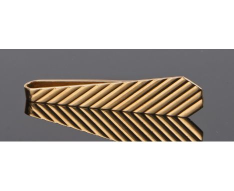 14 carat gold tie clip, in the form of a ribbed tie, 10.2 grams From the estate of the Late Alan SearleAlan was private secre