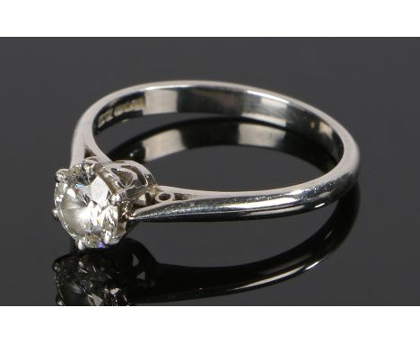 Platinum and diamond set solitaire ring, the round cut diamond at approximately 0.7 carat, ring size P 1/2