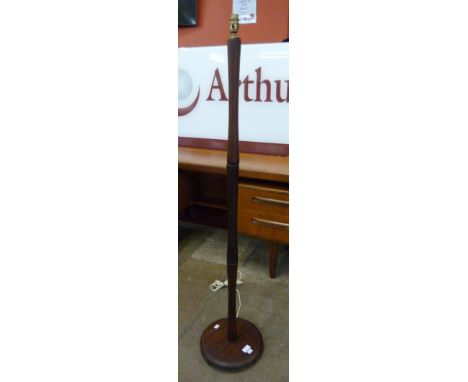 A teak standard lamp 