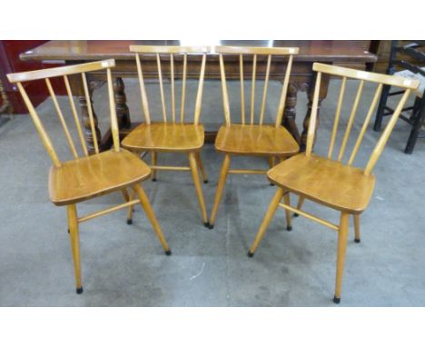A set of four Ercol elm and beech 391 model chairs 