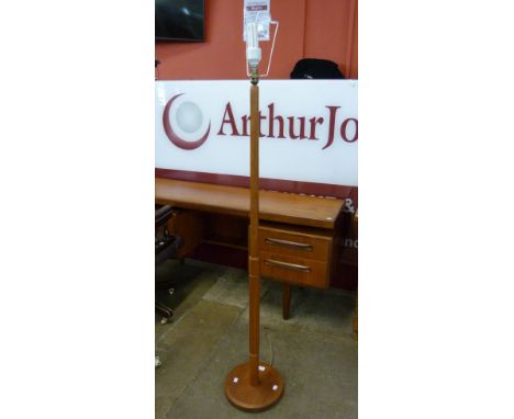 A teak standard lamp 