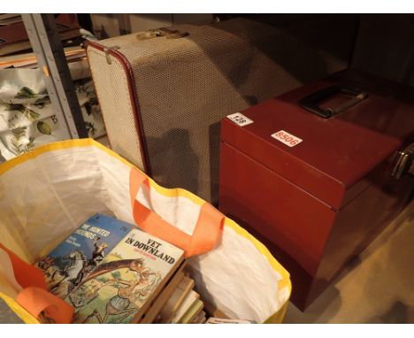 Shelf of mixed items including childrens books