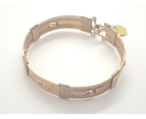 Fancy gold plated bangle with safety chain