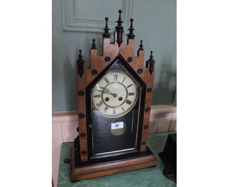 A mahogany and ebonised striking steeple mantel clock