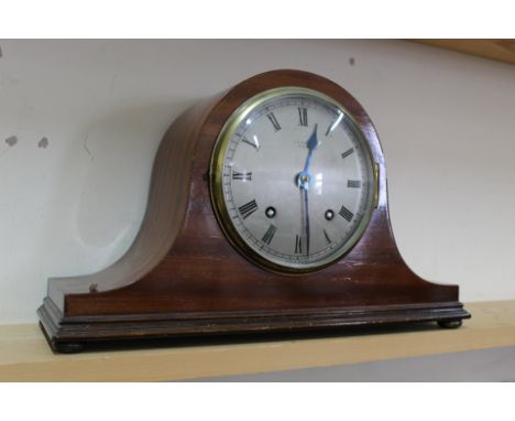 A mahogany Napoleons hat striking mantel clock