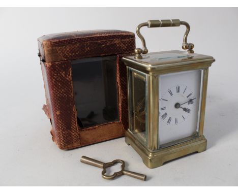 A cased French brass carriage clock