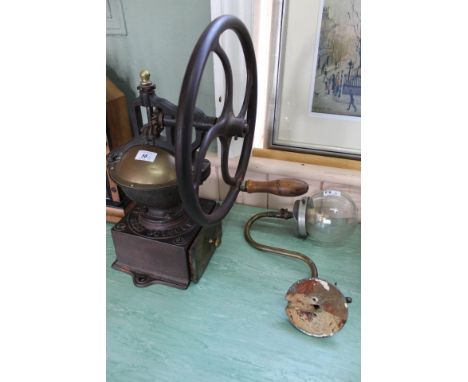 A vintage Peugeot Freres Brevette iron and brass hand cranked grocers coffee grinder plus a brass swan neck gas lamp