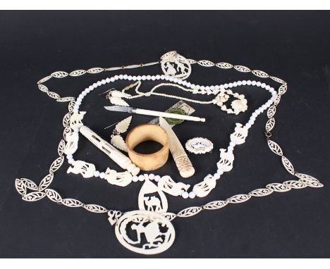 A quantity of bone and celluloid items including napkin ring, necklace etc