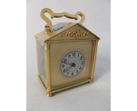 A French brass carriage clock of architectural form