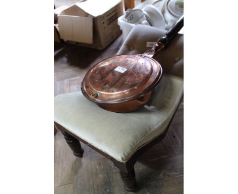A Victorian mahogany gout stool plus a copper warming pan