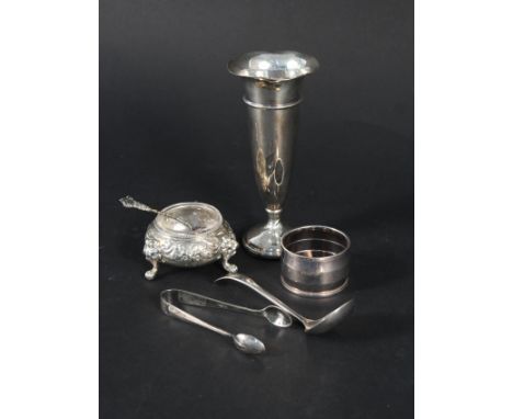 A small silver vase, a silver salt, silver napkin ring etc