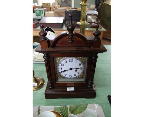 A mahogany striking mantel clock