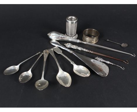 A mixed lot of silver spoons, silver rimmed match striker (as found), silver handled button hooks, shoe horn etc 