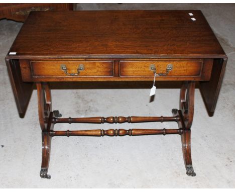 A Regency style mahogany sofa table, fitted with two drawers
