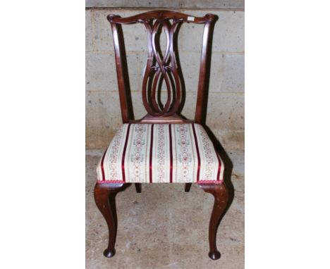 A 1920s Chippendale style mahogany side chair, carved and pierced back splat, silk upholstered seat, raised on cabriole legs,