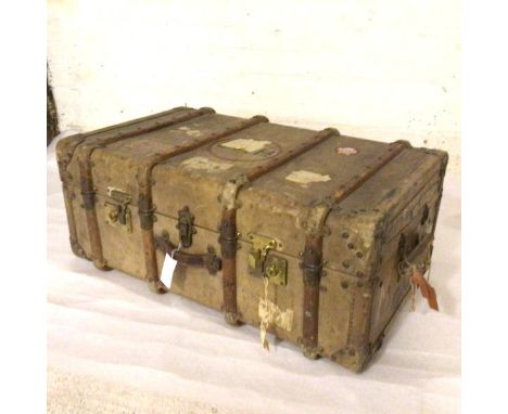 A pigskin bound trunk, c.1900, complete with key and miscellaneous labels etc., with carry handles to side and front (33cm x 