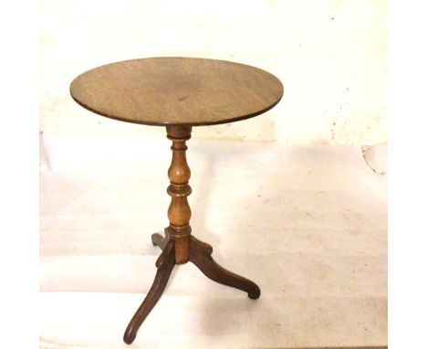 A 19thc mahogany pedestal wine table, the circular top on baluster turned column and tripod support