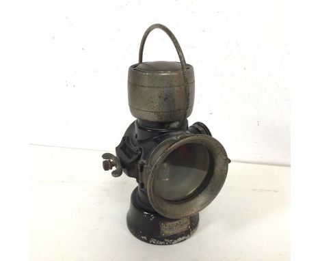 A 1920s/30s King of the Road lamp with clear glass to front and red to one side, bears plaque Lucas no.630(27cm)