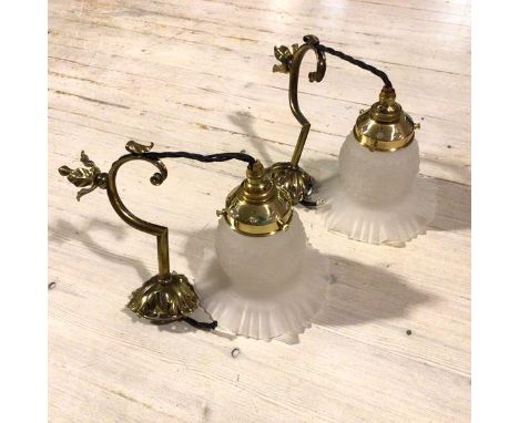 A pair of Edwardian cast brass pendant light fittings with opaque moulded glass crimped floral style shades (drop: 37cm. shad