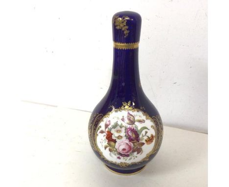 An enamel painted porcelain flask form bottle, probably French, with blue ground and gilt and floral decoration (24cm) (losse