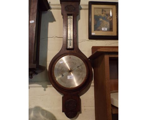 An Edwardian Oak Wheel Barometer, Glass Detached