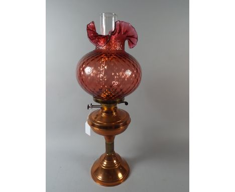 A Copper Oil Lamp with Coloured Glass Shade and Plain Chimney