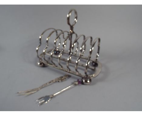 A Silver Thistle Fork, Continental Silver (800) Rose Fork and A Silver Plated Toast Rack By Walker & Hall 