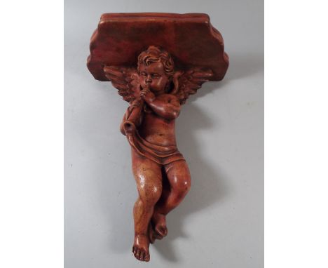 A Cast Sconce Shelf in The Form of Cherub Playing Musical Instrument 