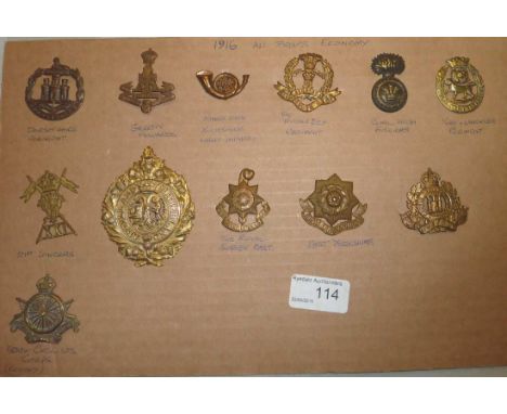 Sheet of 12 regimental cap badges inc Army Cyclist Corp, 21st Lancers, Green Howards, East Yorkshire etc (Possible Reproducti